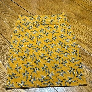 LulaRoe Cassie pencil skirt.Size Large. Excellent condition.Mustard w/blue birds
